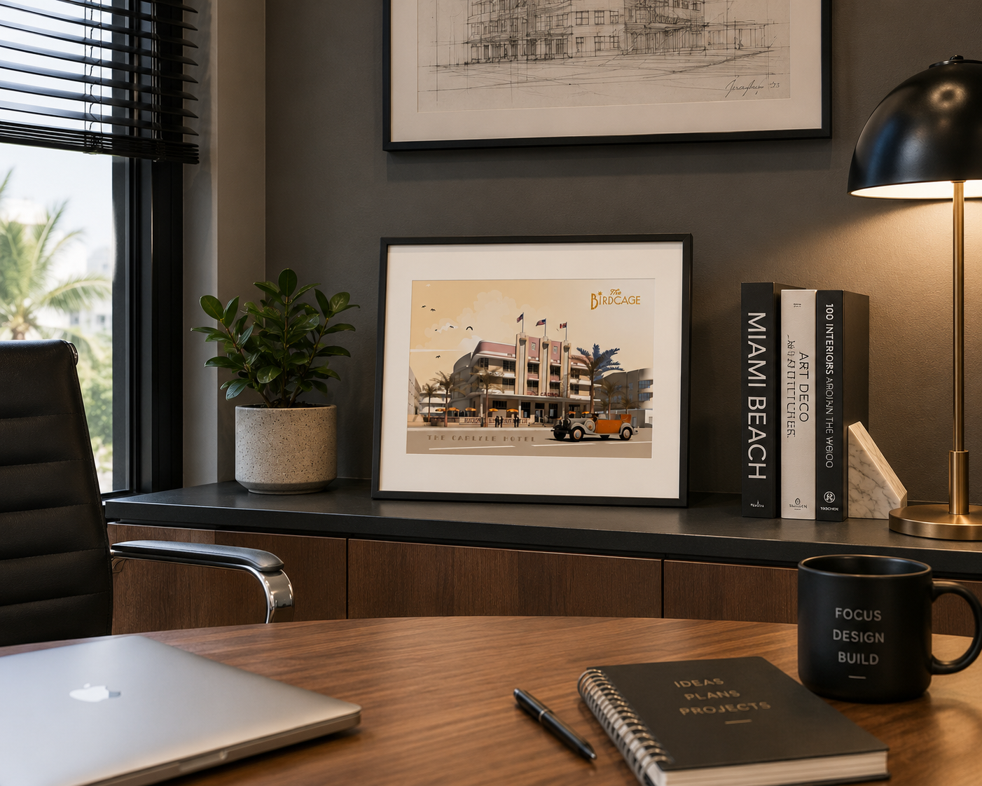 Framed photo of the Carlyle Hotel Print in a black frame on a counter behind a desk.