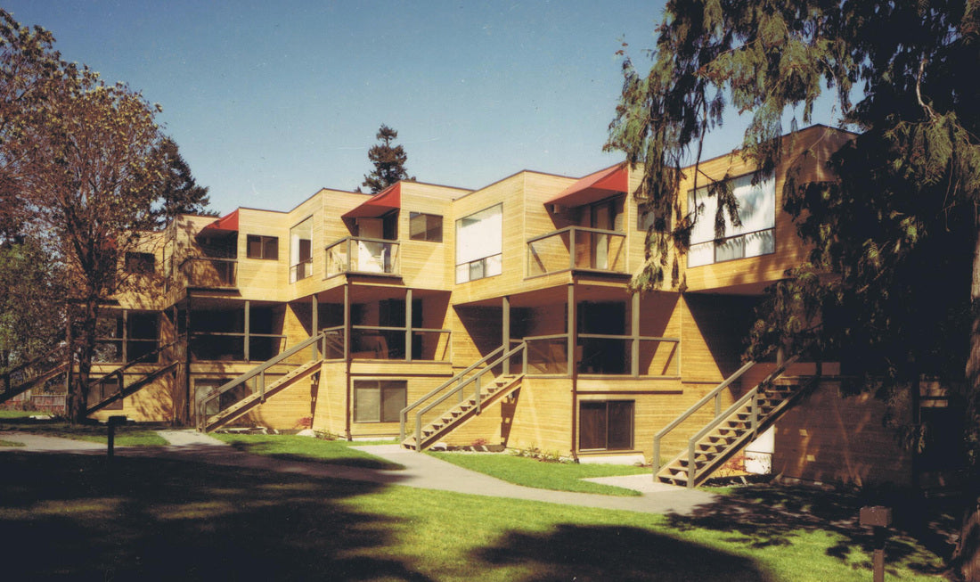 Completed Inn of the Sea Resort in Ladysmith, British Columbia, featuring contemporary wood-clad condominium buildings with private balconies, exterior stairways, and landscaped grounds overlooking the waterfront.