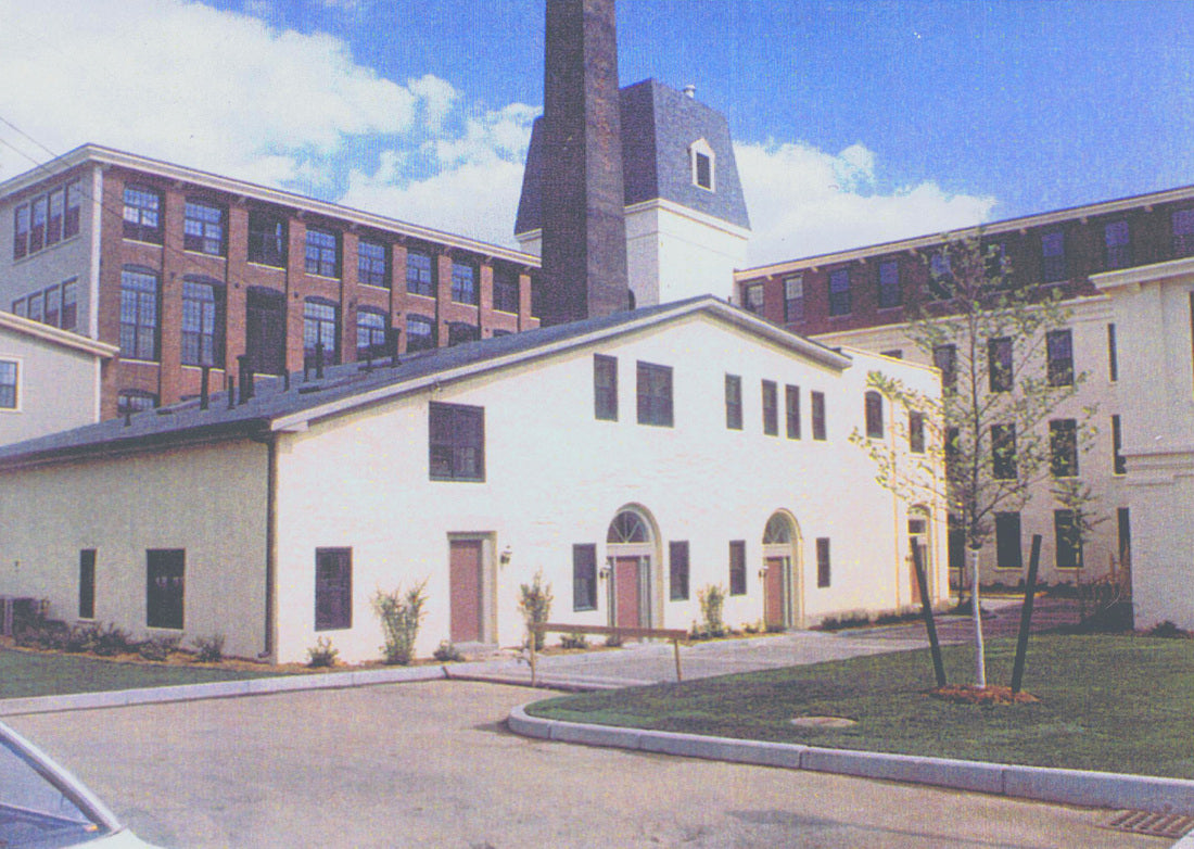 Completed adaptive reuse buildings surrounding the historic mill complex.