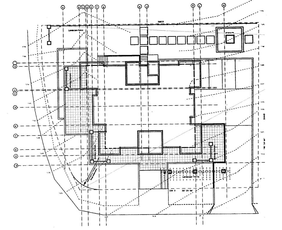 Site plan illustrating the building footprint, landscaped outdoor areas, circulation, and overall site organization.
