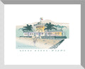 A framed art print featuring an illustration of a South Beach & Pizza restaurant with an Art Deco style facade, set against a white background.