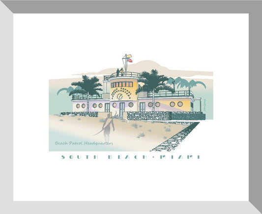 A framed art print featuring an illustration of a South Beach & Pizza restaurant with an Art Deco style facade, set against a white background.